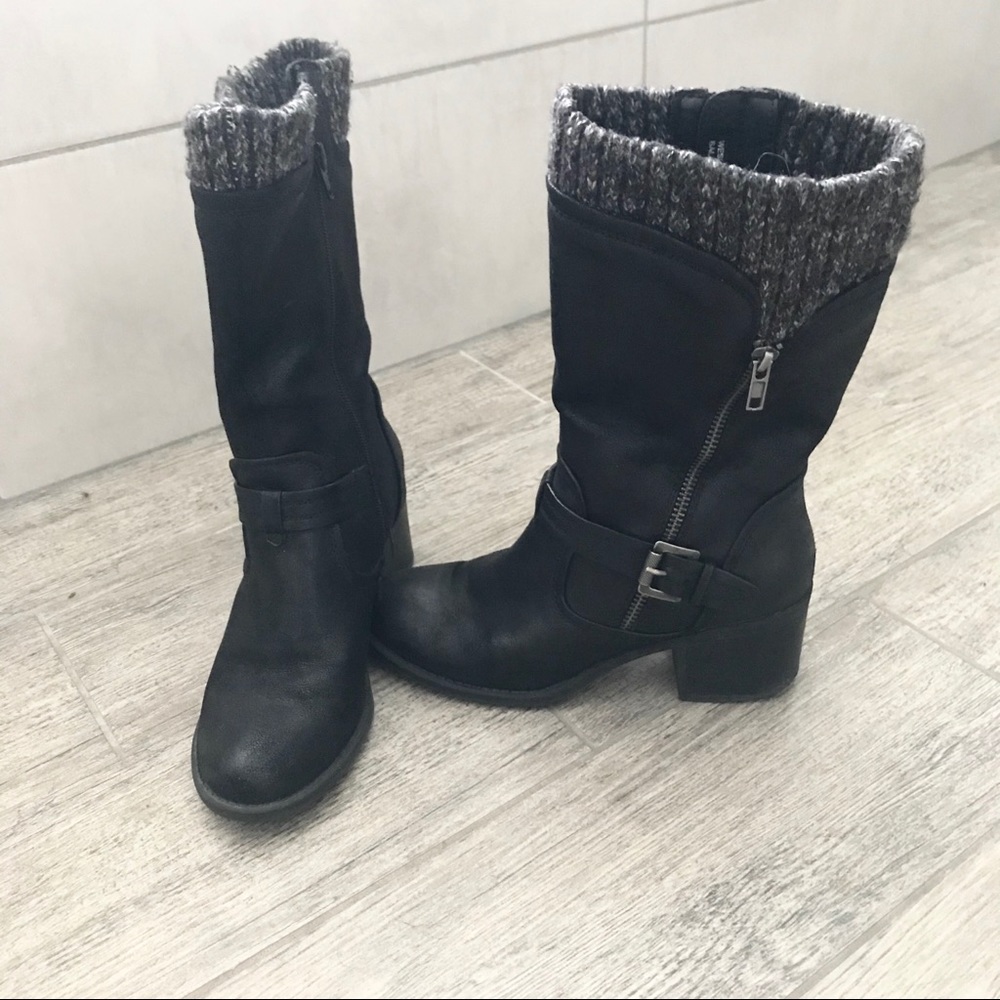 Black boots with builtin appearance of a sock.